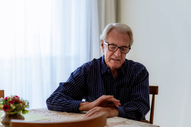 Portrait of gentleman with glasses sitting near the table Portrait of gentleman with glasses sitting near the table.Aging Portraits of the Elderly. vietnamese old man portrait stock pictures, royalty-free photos & images