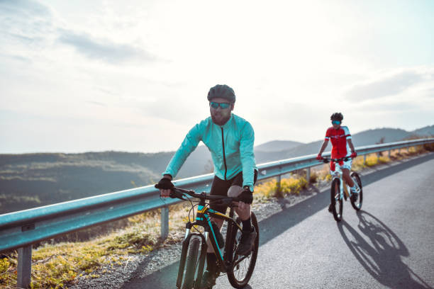 istock Downhill Fun For Bearded Cyclist Couple 1320986488