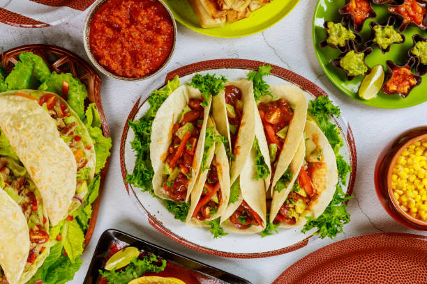 istock Traditional dishes from corn tortillas, taco shells with salsa. 1320986506