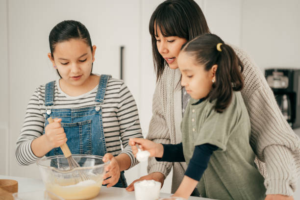 istock Mom cooking with kids 1320986873