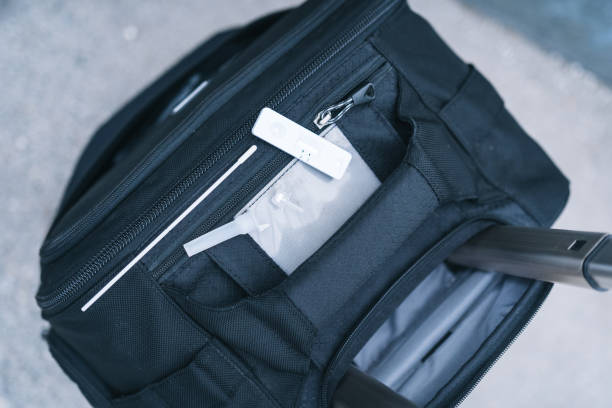 istock View of covid-19 self-testing kit on top of suitcase 1320990373
