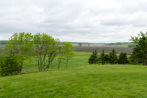 Wisconsin farmland and trees starting to change color in September, horizontal