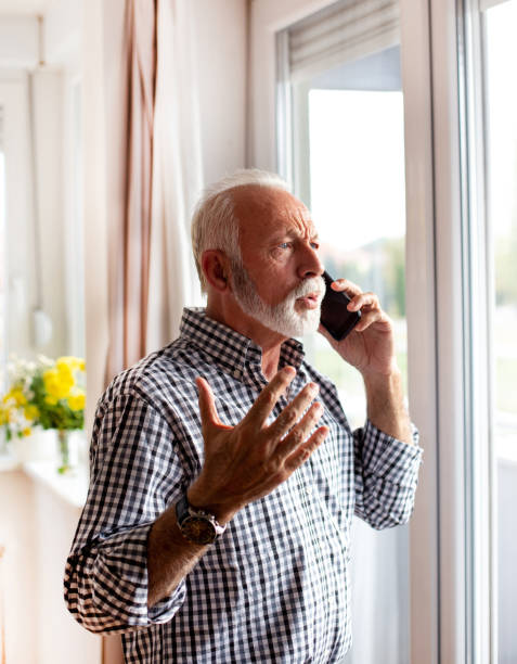 istock Senior man talking on phone beside wnow 1320990723