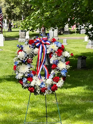 Red, White and Blue floral wreath displayed at a cemetery for the Memorial Day holiday