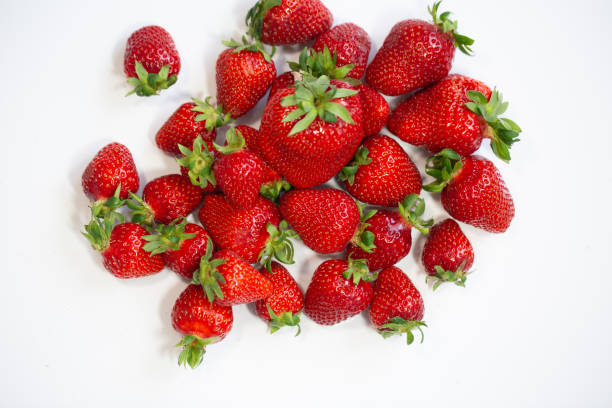 istock Strawberries in a bowl, white background 1320992082