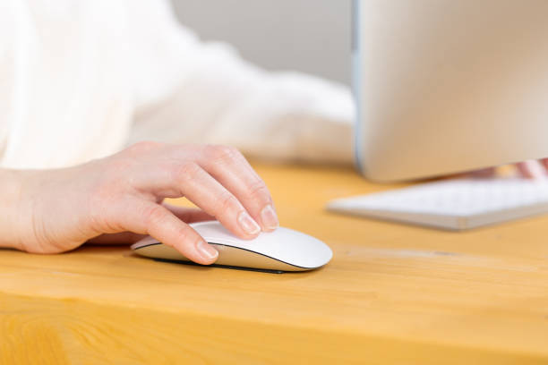 istock Close-up of young female hands pressing keyboard buttons and using a mouse. work from home. office. shopping 1320992935