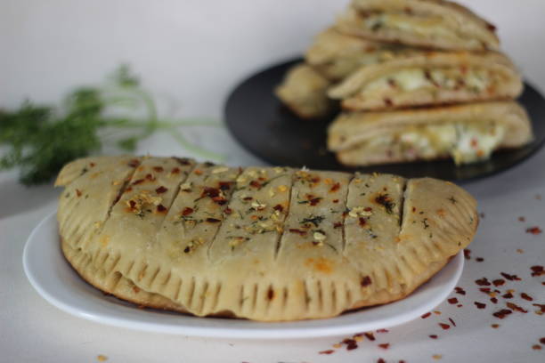 istock Home baked garlic bread filled with mozzarella cheese. 1320993183