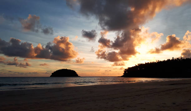 istock sunset with golden cloudy sky at kata Beach Thailand 1320994608