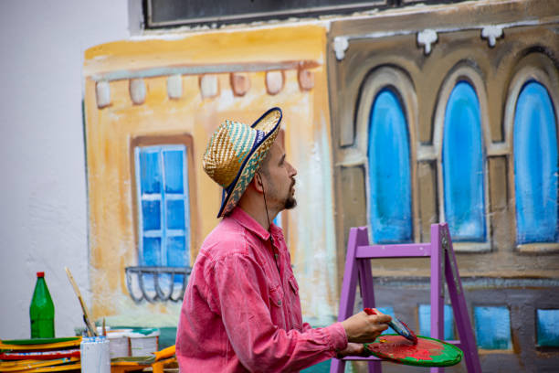istock Artist painting wall mural 1320994645