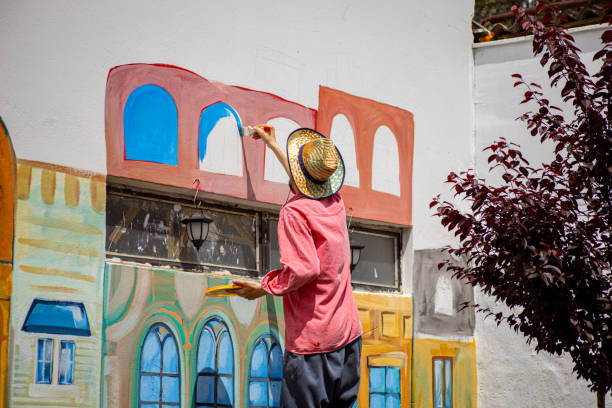 istock Mural painting with big brush 1320994678