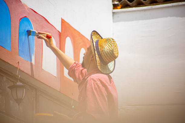 istock Mural painting with big brush 1320994710