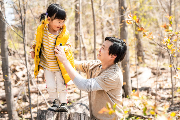 istock Dad and daughter walking in the park 1320995676