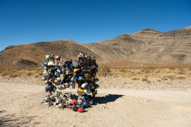 Pile of Teapots On The Sign at Teakettle Junction Pile of Teapots On The Sign at Teakettle Junction in Death Valley National Park teakettle junction stock pictures, royalty-free photos & images