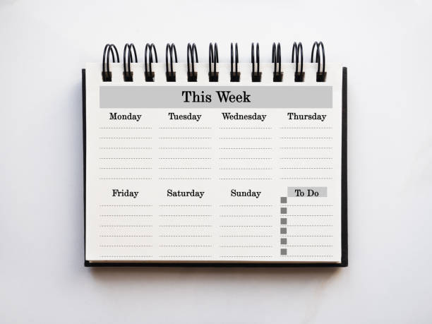 Blank notepad sheet and calendar for your congratulatory message. Closeup, top view. No people. Concept of preparation for a holiday. Congratulations for relatives, friends and colleagues