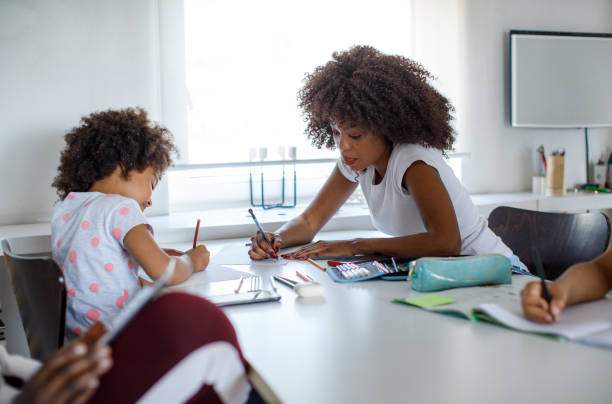 istock Mother And Daughter Coloring Together 1320999420