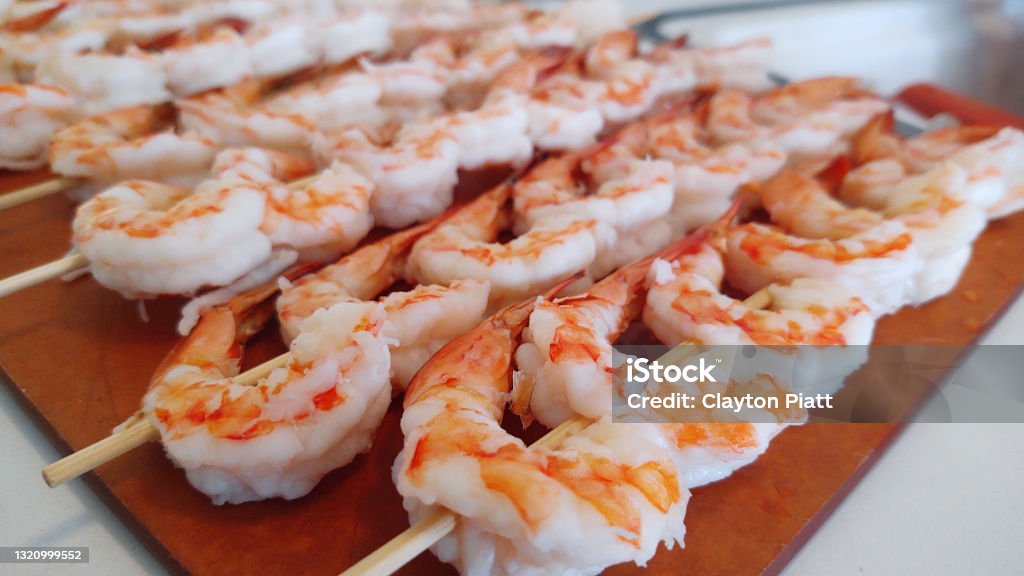 Shrimp on shish kabob Being Prepaired to be cooked on the grill Seafood Meal of Shrimp Kebab, Ready To be Cooked Appetizer Stock Photo