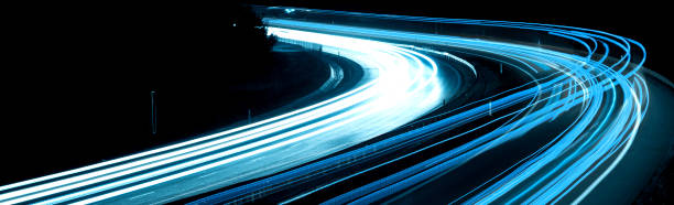 istock blue car lights at night. long exposure 1321000740