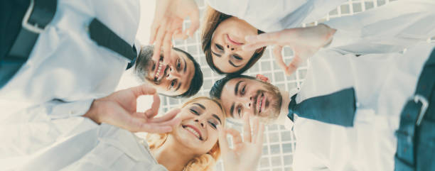 istock The four happy people gesture to the camera 1321000902