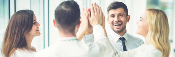 istock The happy business people greeting with a high five 1321000944