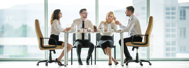 istock The business people sit at the table in the conference 1321001063