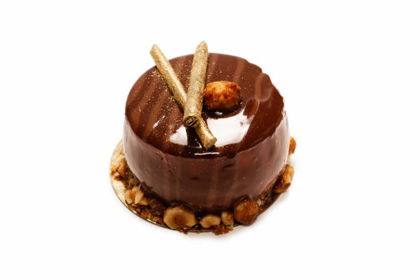 istock Chocolate and caramel cake isolated on a white background. 1321004854
