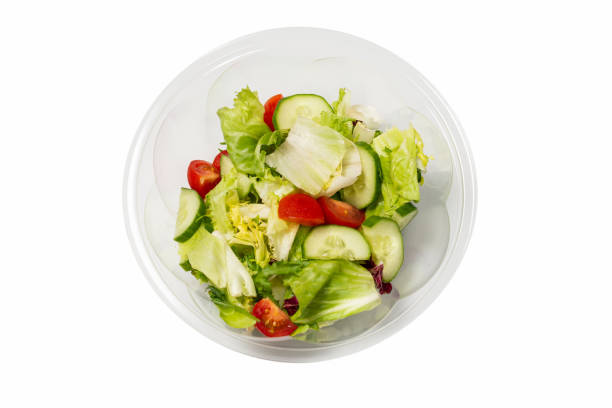 istock Salad with fresh vegetables isolated on a white background. 1321004868