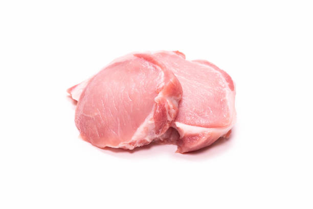 istock Raw pork pieces isolated on a white background. 1321004869