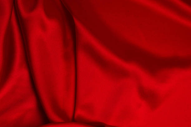 istock Red silk or satin luxury fabric texture can use as abstract background. 1321004965