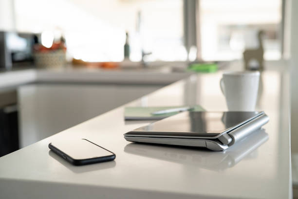 istock Portrait of home office elements on kitchen counter in the morning 1321005021