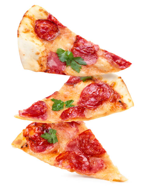 istock Slices of salami pizza falling on a white background. Isolated 1321005654