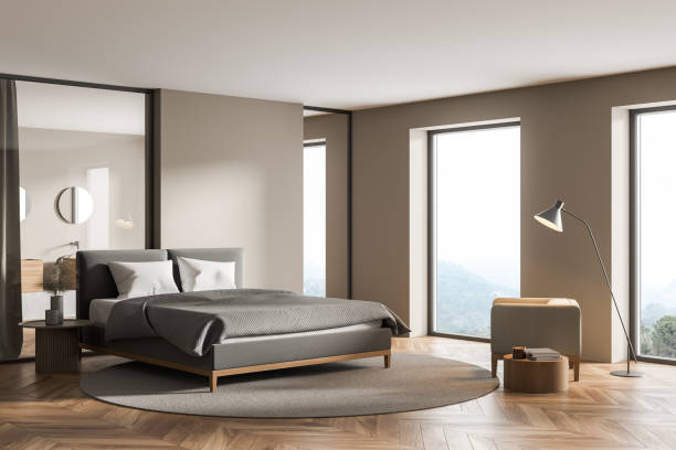 istock Modern cozy bedroom interior with large comfortable grey bed 1321007988