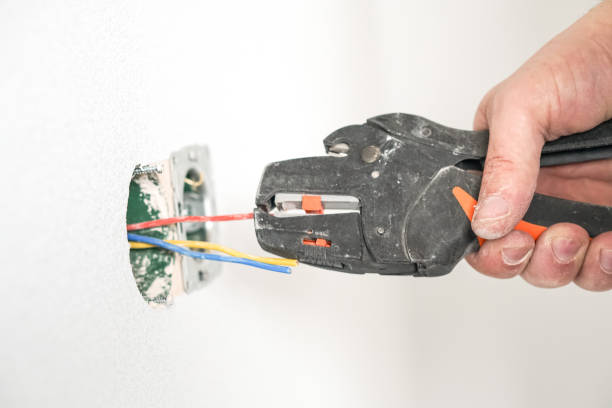 istock Electrician, monitors the wires in the sockets. Close up with tools 1321009199