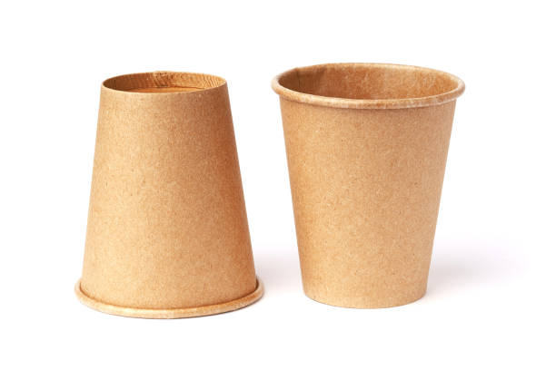 istock paper cup made of ecological materials, one is standing the other upside down, isolated on a white 1321011302