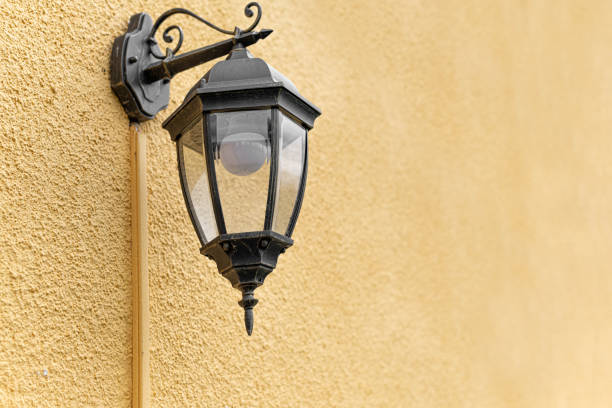 istock Lantern in the old style on the wall. 1321012631