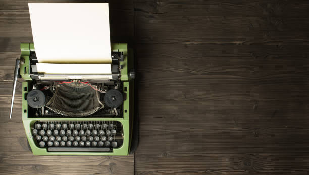 istock vintage typewriter and magnifier on handbook 1321013448