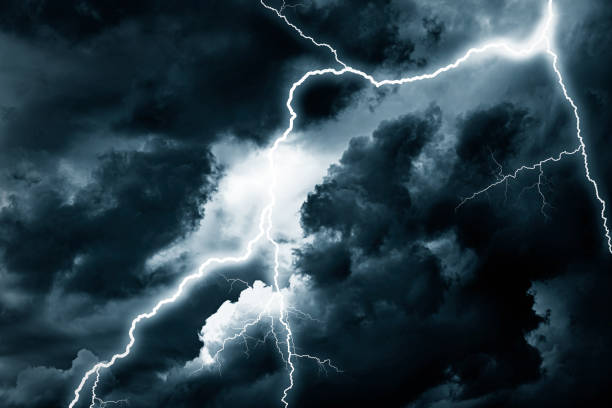 istock Lightning strike against the background of a cloudy sky. 1321013532
