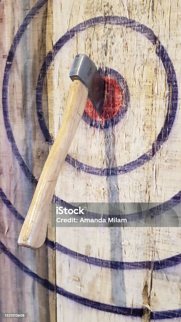 Bullseye Axe in bullseye Axe Throwing Stock Photo