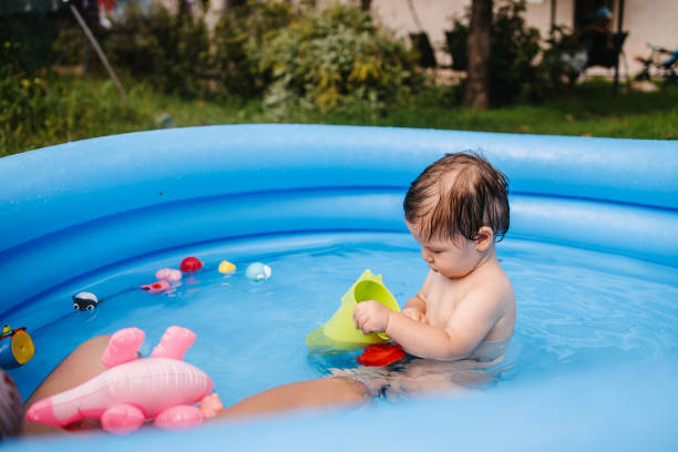 istock Toddler playing in the inflatable pool 1321013806