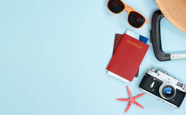 istock traveler's accessories on light blue background 1321014106
