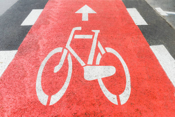 istock Bicycle path, with a sign on the pavement informing about the path. 1321016539