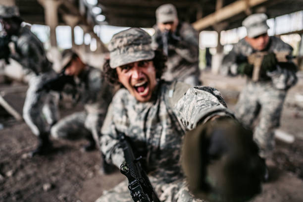 istock Soldier charging in battle with his squad 1321017151