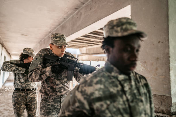 istock Military squad patrolling through ruined building 1321017276