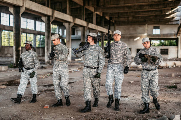 istock Military squad patrolling through ruined building 1321017339