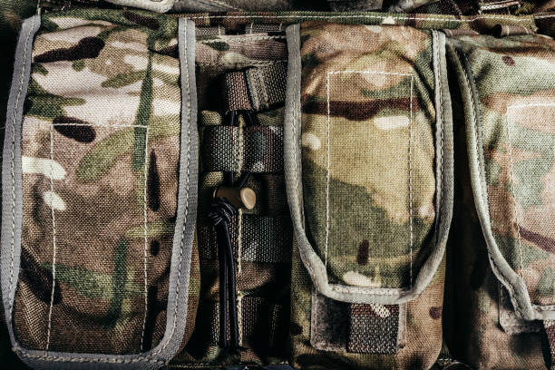 istock Multi camouflaged soldier vest pouches. 1321017552