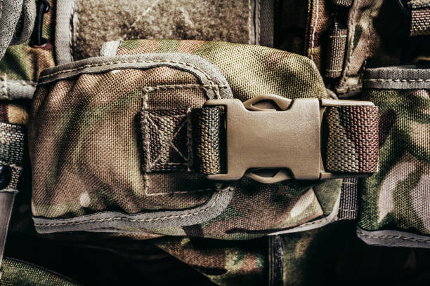 istock Multi camouflaged soldier vest pouch with lock catch. 1321017742