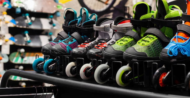 istock Various colored roller skates standing on sport store shelf. 1321017920