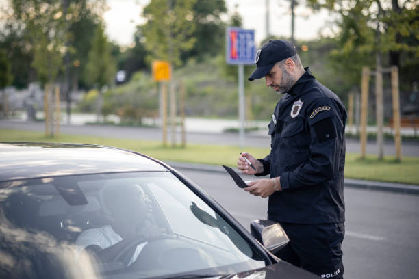 istock Middle aged Caucasian male police officer at work 1321017932