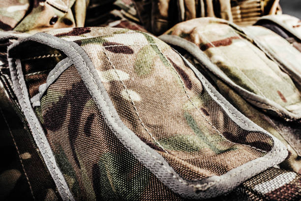 istock Multi camouflaged soldier vest pouches. 1321017989