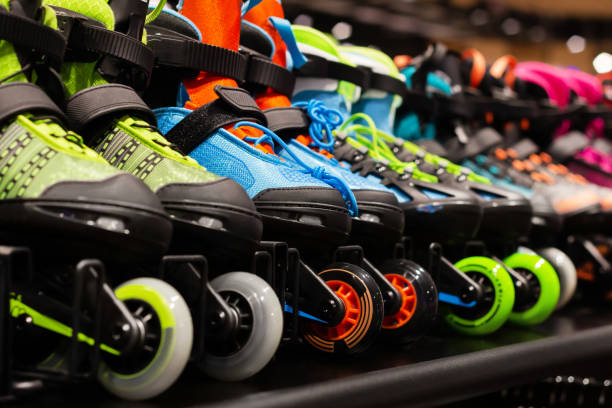 istock Various colored roller skates standing on sport store shelf. 1321018001