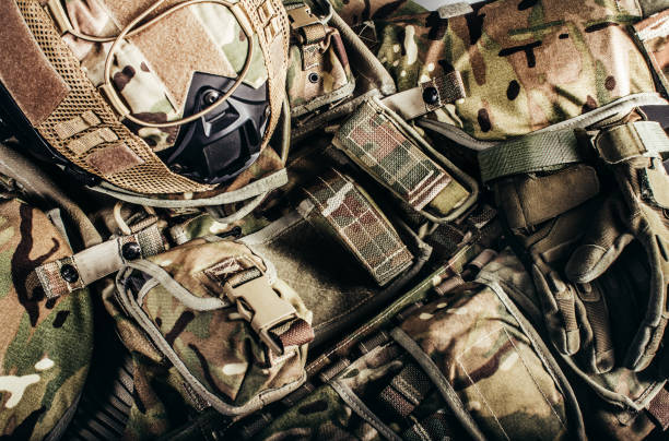 istock Level 3 protection soldier ammunition and helmet laying on table. 1321018032